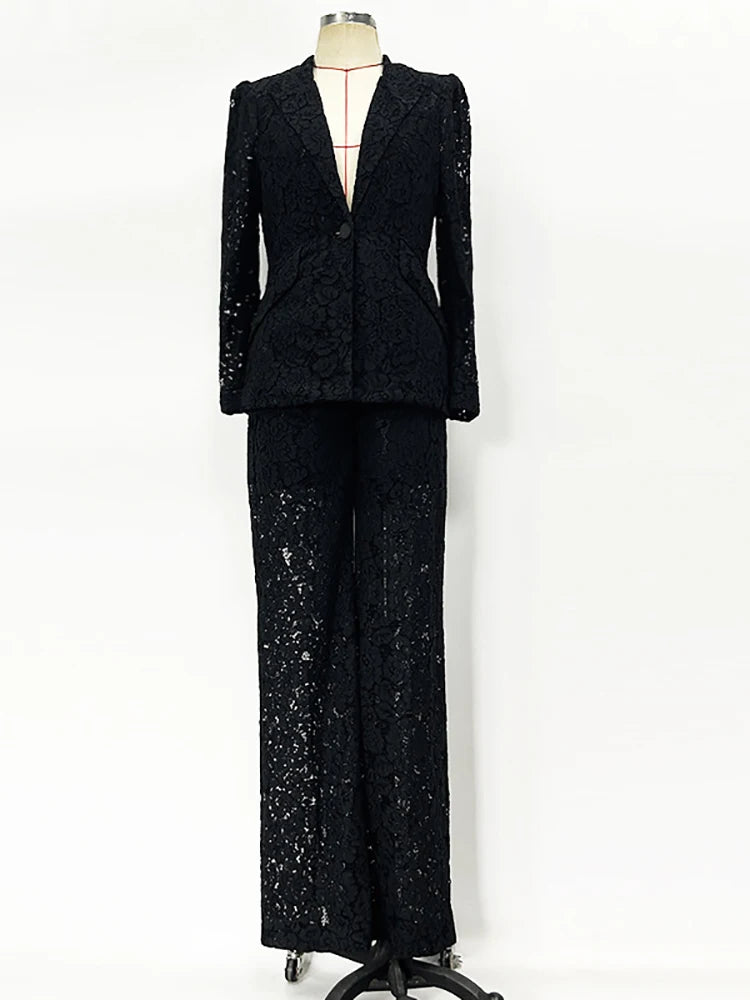 Black sequin suit on a mannequin against a white background