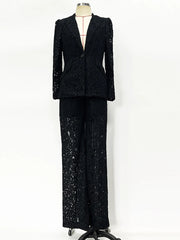 Black sequin suit on a mannequin against a white background