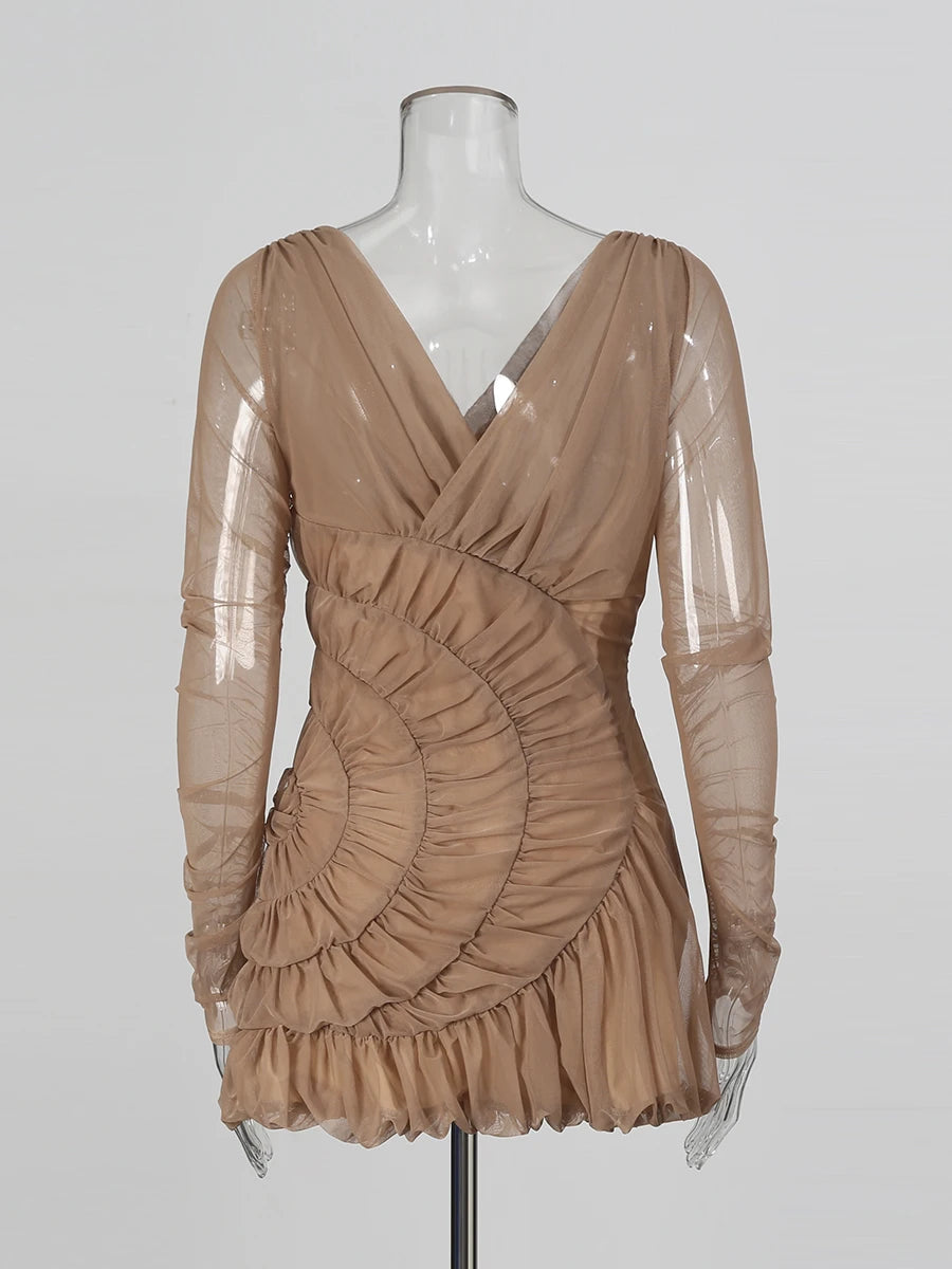 Beige dress on a mannequin against a white background