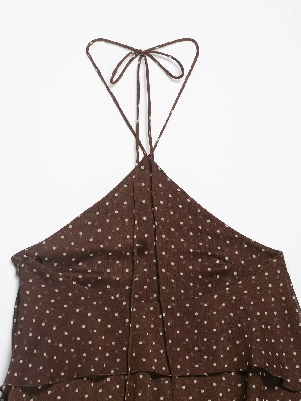 Brown polka dot dress with thin straps on a white background