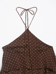 Brown polka dot dress with thin straps on a white background