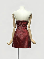 Red dress on a mannequin against a white background