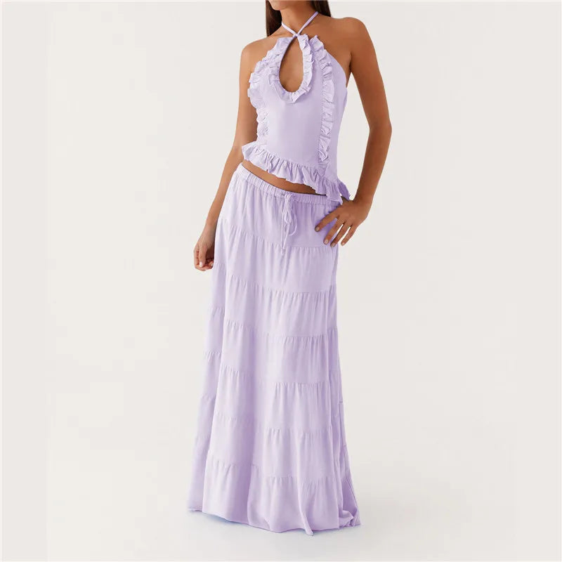 Woman wearing a lavender two-piece outfit on a white background