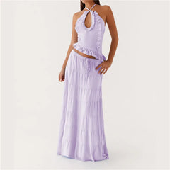 Woman wearing a lavender two-piece outfit on a white background