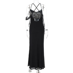 Black dress on a mannequin with thin straps against a white background