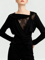 Black long-sleeve top with lace detailing on a white background