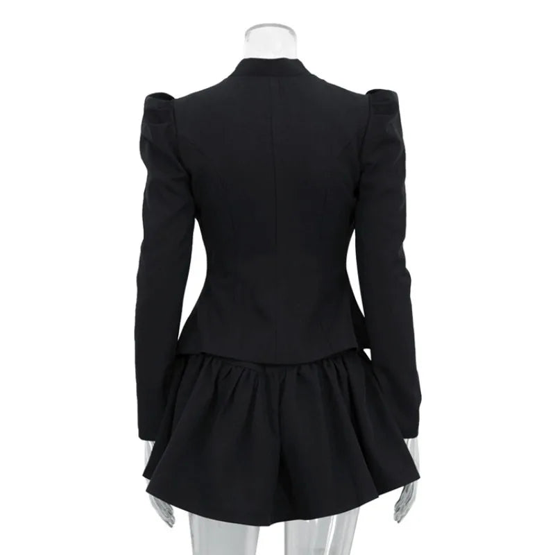 Black peplum jacket on a mannequin against a white background