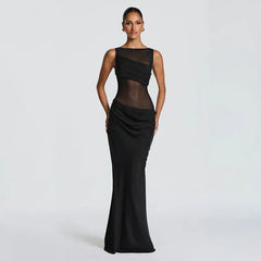 Woman wearing a black evening gown on a light gray background