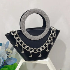 Black crystal handle trapezoid tote bag with silver chain detail