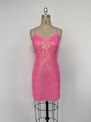 Pink sequin dress on a mannequin against a gray background