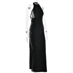 Black evening gown with sheer panels on a white background