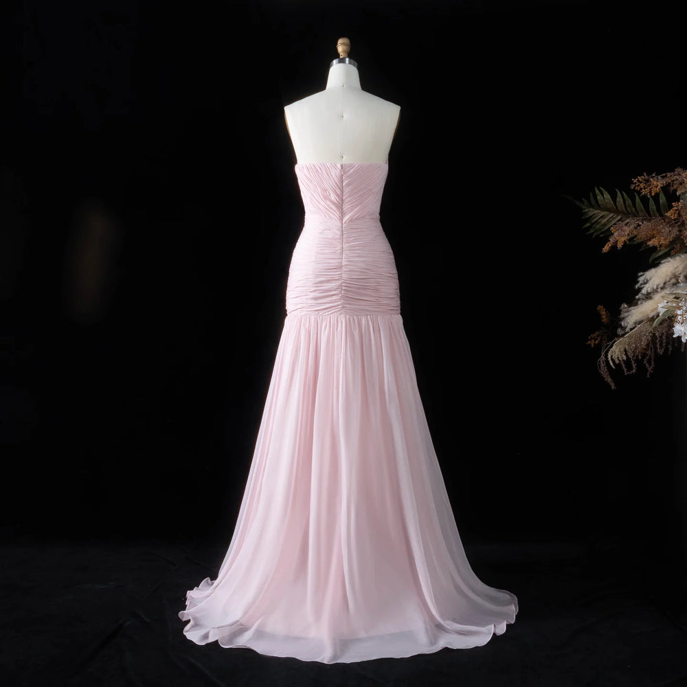 Strapless ruched chiffon trumpet evening dress on mannequin back