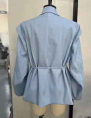 Light blue coat on a mannequin against a neutral background