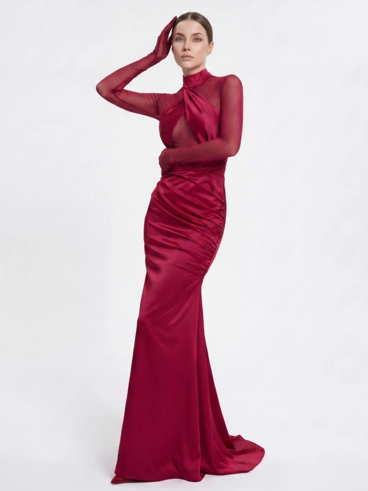Close-up of the detailed neckline and sleeves of a ruched gown