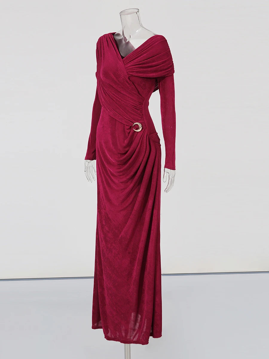 Maroon evening gown on a mannequin against a white background