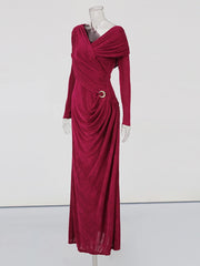 Maroon evening gown on a mannequin against a white background