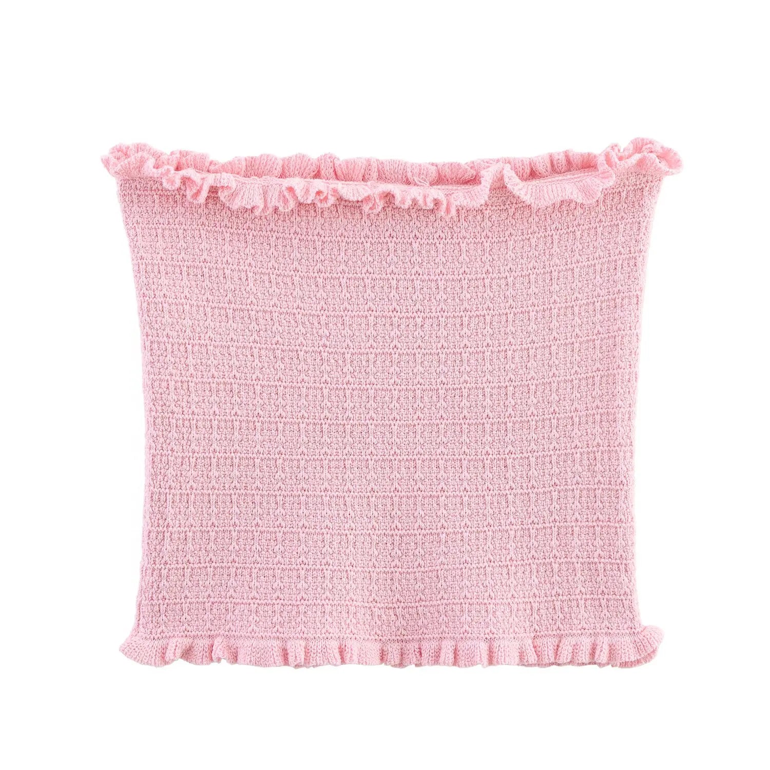 Pink textured pillow with ruffled edge on a white background