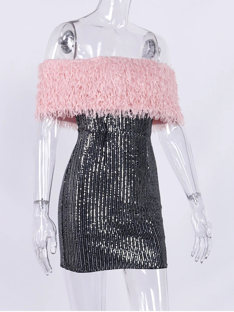 Mannequin wearing a dress with pink top and black sequin skirt on a white background