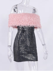 Mannequin wearing a dress with pink top and black sequin skirt on a white background