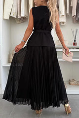 Woman wearing a black dress in a clothing store setting