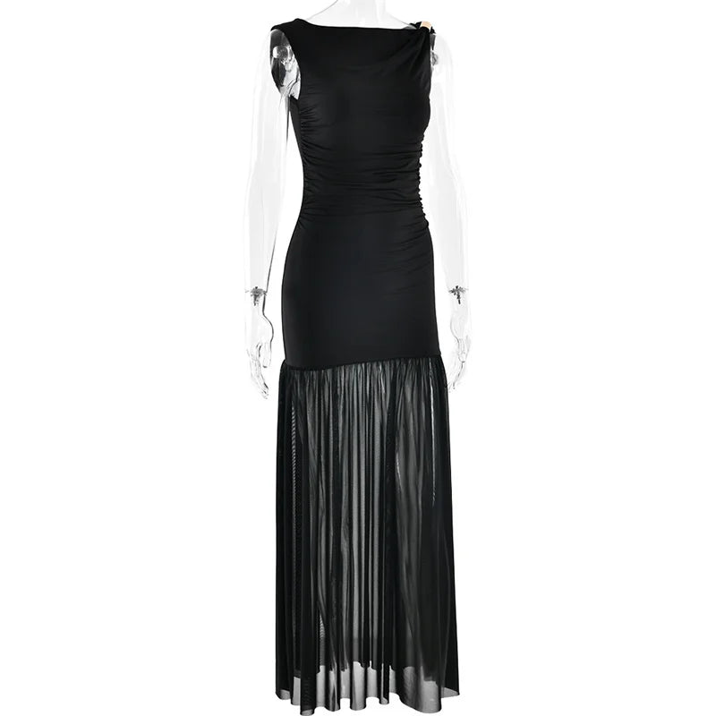 Black evening gown with sheer overlay on a white background