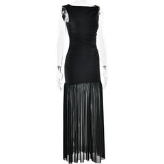 Black evening gown with sheer overlay on a white background