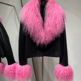 Black jacket with pink fluffy trim on a mannequin against a white background