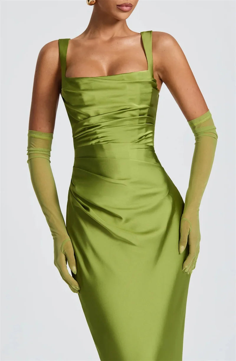 Woman wearing a green satin dress with matching gloves- close-up