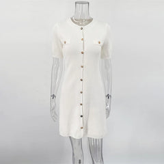 White cardigan on a mannequin against a white background