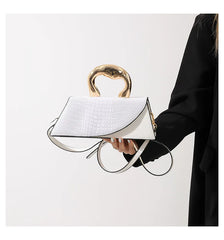 White alligator textured top handle bag with golden handle