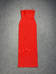 Red dress with thin straps on a gray background