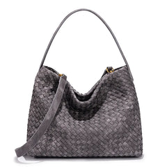 Gray woven handbag on a white background