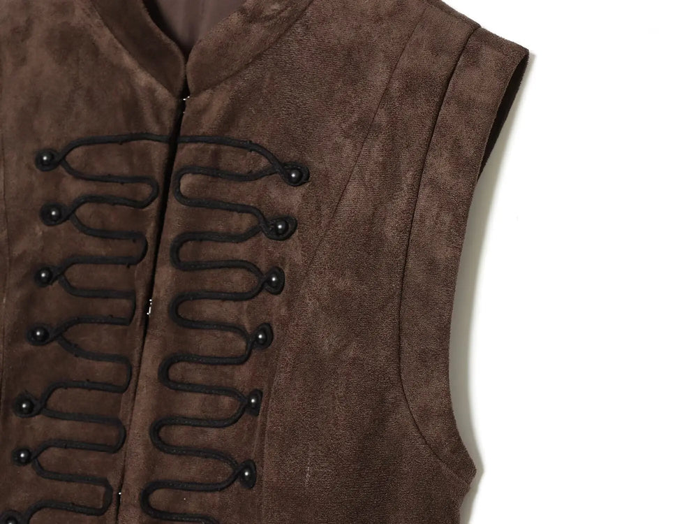 Close-up of decorative knot button detail on vest top