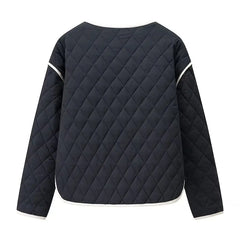 Back view of a navy quilted jacket with white piping on a white background