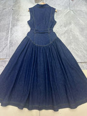 Denim dress on a hanger against a tiled floor background
