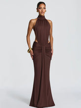 Woman wearing a brown evening gown on a white background