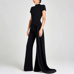 Black jumpsuit worn by a model on a white background