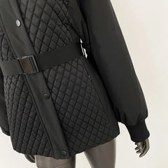 Black quilted jacket with a belt on a mannequin against a white background