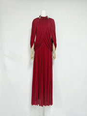 Red evening gown on a mannequin against a white background