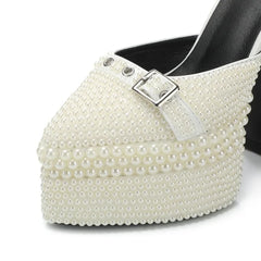 White pearl-embellished high-heeled shoe on a white background