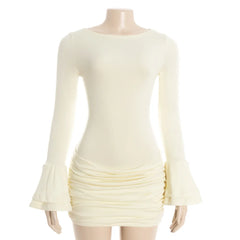 Cream-colored dress with ruched skirt on a mannequin against a white background