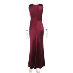 Maroon evening gown on a mannequin against a white background