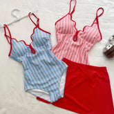 Blue striped bikini top and red skirt