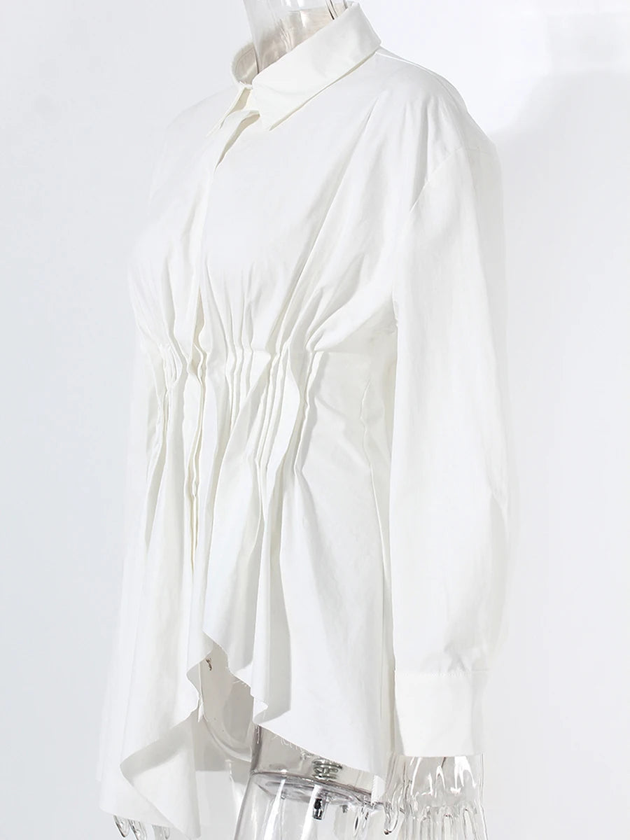 White blouse on a mannequin against a white background