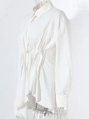 White blouse on a mannequin against a white background