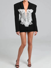 Black blazer with lace detailing over a white background