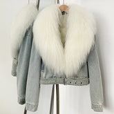 Denim jacket with white fur collar on a stand against a white background