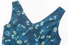 Close-up of the v-neckline on a daisy print maxi dress