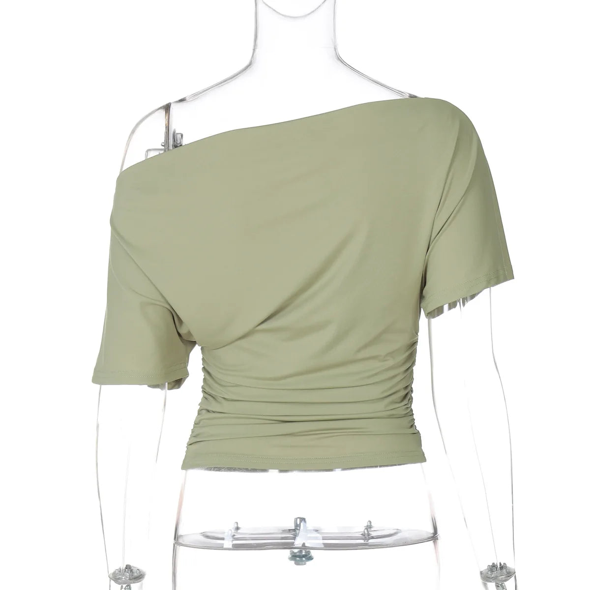 Green one-shoulder top on a mannequin against a white background