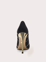 Black high-heeled shoe with gold sole on a white background